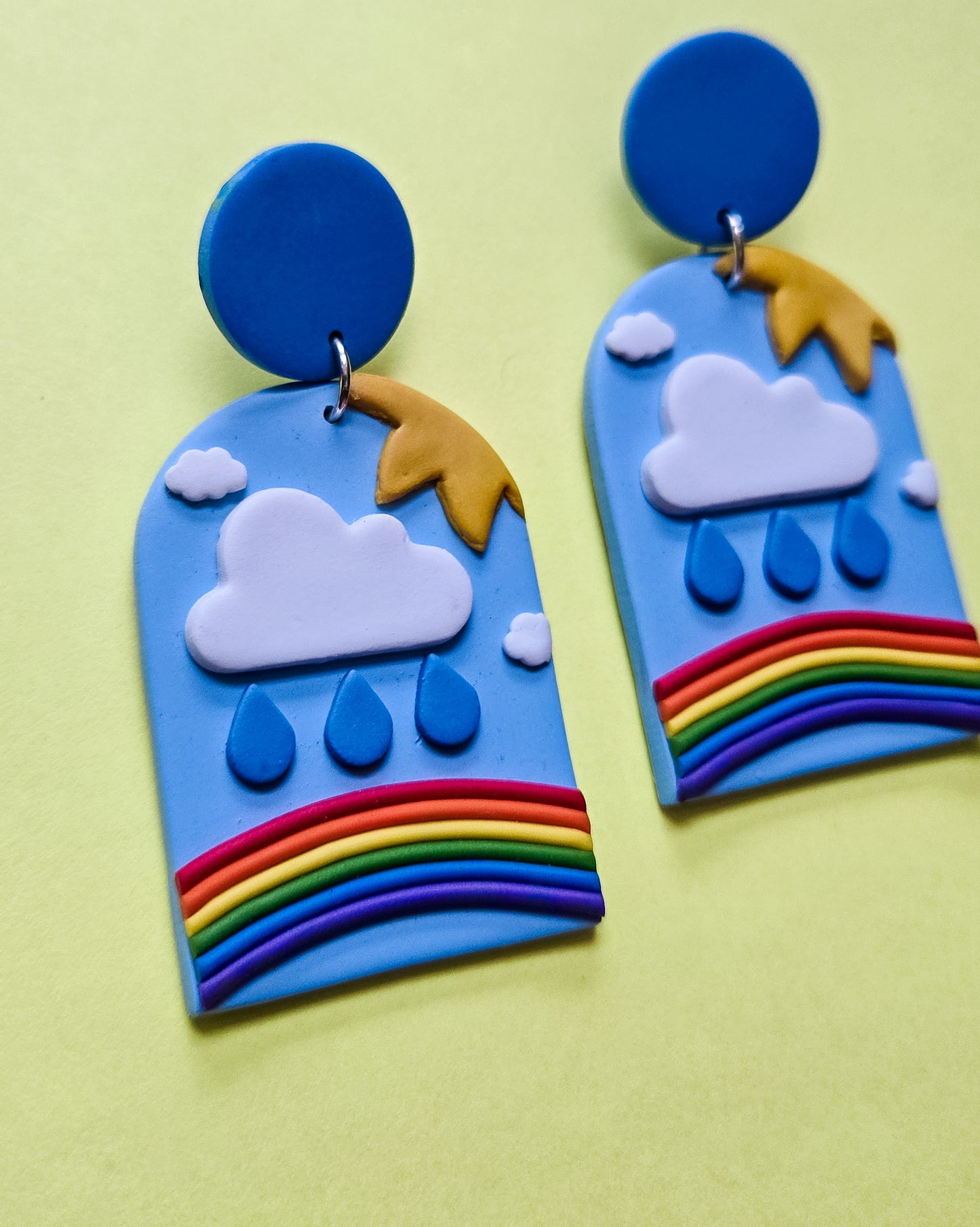 Queer Freedom earrings, pain (rain), confusion (clouds), joy (sun) and liberation (rainbow)